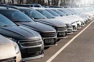 row of cars at a dealership