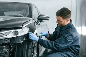technician working on a car
