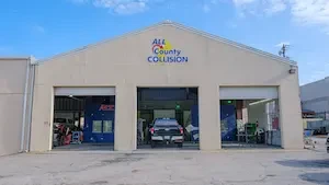 outside of a white collision repair shop