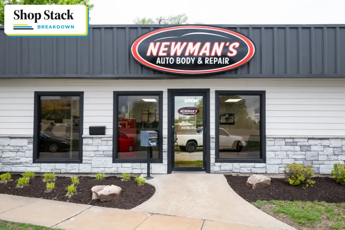 front of Newman's auto body, white building with a black roof