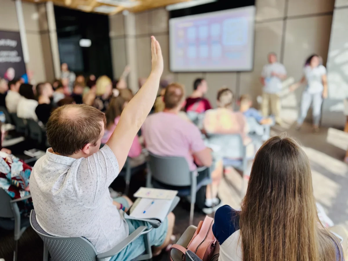 people sitting in a room at a presentation