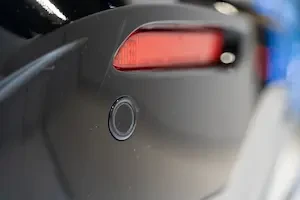 A rear parking sensor integrated into a vehicle bumper