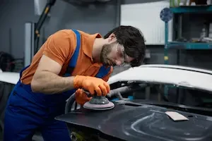 Technician working on a car