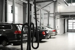 cars inside a collision repair shop