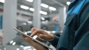 mechanic holding a tablet