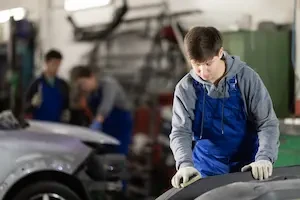 auto technician working on a car