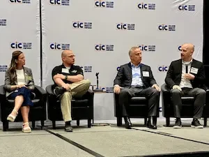 four people sitting on a panel