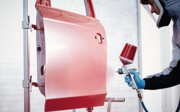 AX spraying a panel