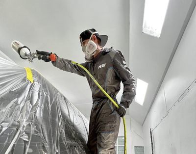 painter-spraying-in-booth