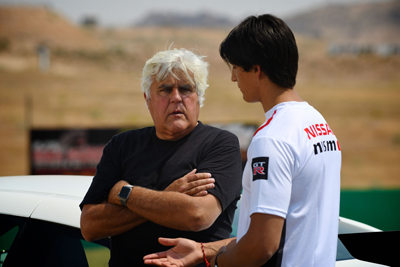 two-men-talking-by-race-car