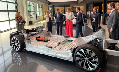 people-looking-at-EV-chassis