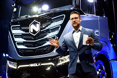 man-standing-in-front-of-truck