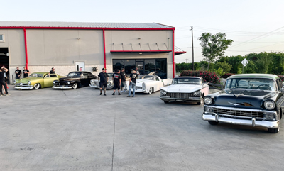 staff-and-cars-outside-body-shop