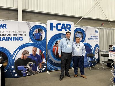 Paul Hill, left, and Jeff Russell, right, at the I-CAR booth.