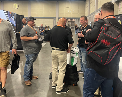 Mike Anderson of Collision Advice meeting with industry colleagues on the show floor.