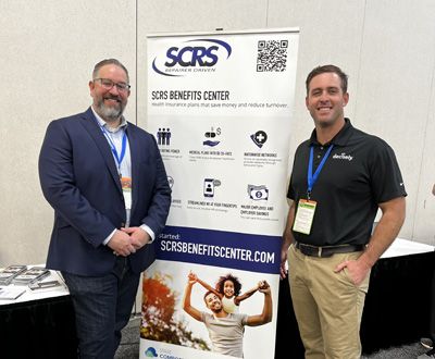 Aaron Schulenburg, left, and Richie Seaberry, right, at the SCRS booth.
