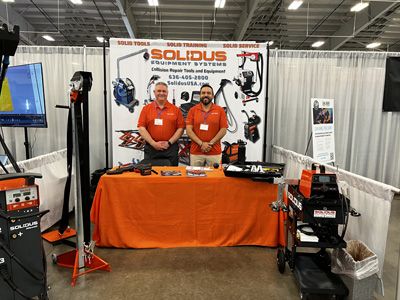 John Pankau, left, and Jesus Munoz, right, at the Solidus booth.
