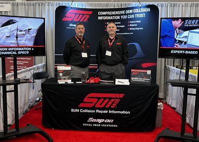 Ross Whiteley, left, and Chris Bonneau, right, at the SUN Collision booth.