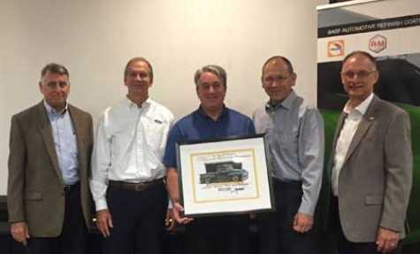 BASF Presents guests from the Ford collision group with a signed Chip Foose rendering after the BASF Performance Group OEM Technology meeting. Left to right: BASF Vision+ Program Manager Craig Seelinger; Ford Collision Marketing Manager Dean Bruce; Ford Damageability/Collision Repair Senior Engineer Customer Service Division Gerry Bonann;  Ford UCS Commodity Process Manager Jerry Boughan; and BASF Manager, OEM &amp; Industry Relations Jeff Wildman.