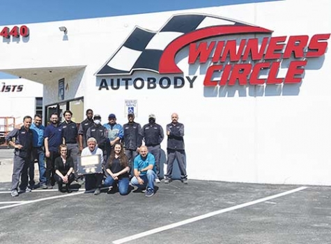 The team at Winners Circle Kustom Autobody. Owner Dale Dlugos is pictured in the center holding the I-CAR plaque. Jose Martinez, shop manager, is standing second from the left in the light blue shirt.