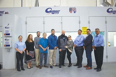 Tom Gregg, owner of Platinum Collision (center), and Al Ortiz, president of Rely-On Technologies (far right) have worked closely together with the rest of Rely-On’s team to acquire Garmat booths in most of Gregg’s eight locations.