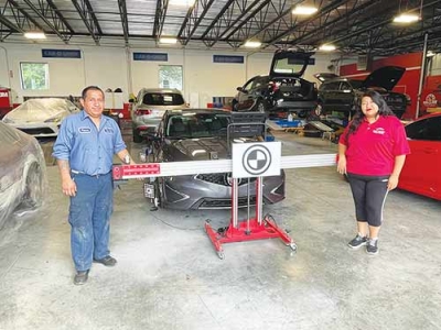 Everyone at New Trimble Auto Body loves their Standard ADAS Calibration Frame working with the new Autel IA800 for its speed and accuracy. At left, Shop Manager Patricio Buri and at right, Office Manager Christina Lopez. 