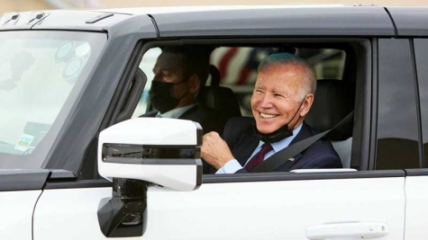 President Joe Biden test drives the 2022 GMC HUMMER EV pickup.