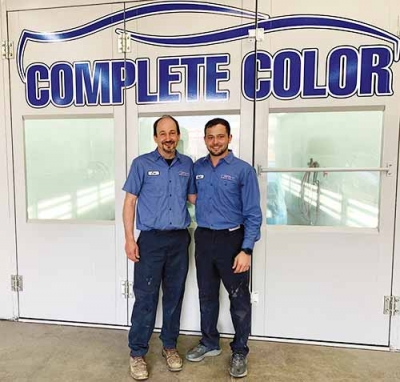 Jim Loynes, left, and his son Austin switched to PPG’s ENVIROBASE High Performance Waterborne paint system and are loving every minute of it. 