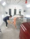 Samuel Bermudez, a student in the collision repair and refinish program at the Applied Technology Center in Rock Hill, SC, uses the DeVilbiss DV1-C on a trainer.