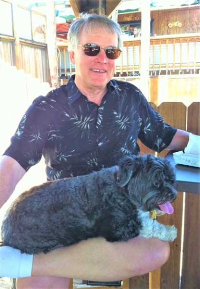 When “semi-retired” collision repair industry consultant Steven Schillinger saw news stories about pets being abandoned in the Nevada desert, he decided to establish Pet-Rescue-AutoShop.com campaign. Here he is pictured with George, his late canine companion.