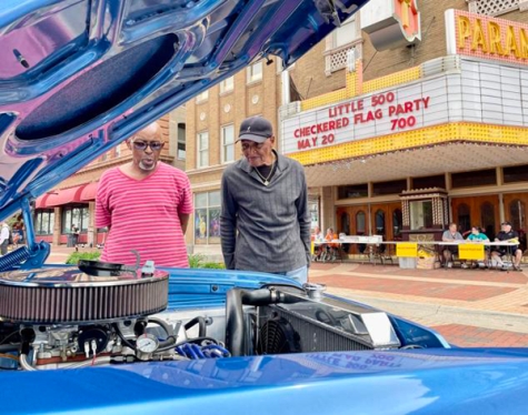 Ron Easley, left, and Charlie Harris, neighbors from Anderson, IN, check out the engine of a 1962 Plymouth Belvedere belonging to Don Cox during the Little 500 Festival Hot Rod and Classic Car Show, May 21 in downtown Anderson.