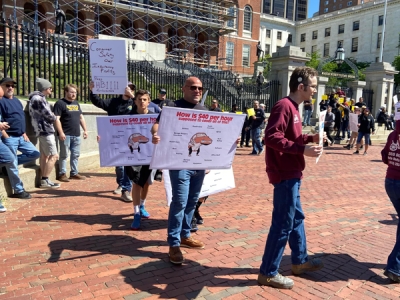 A vocal group of more than 60 people gathered outside the Massachusetts State House to demand action on two proposed bills currently before lawmakers. 