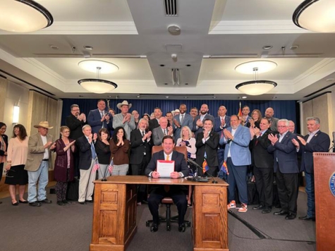 Arizona Gov. Doug Ducey signs legislation widening I-10 south of Phoenix on May 4.