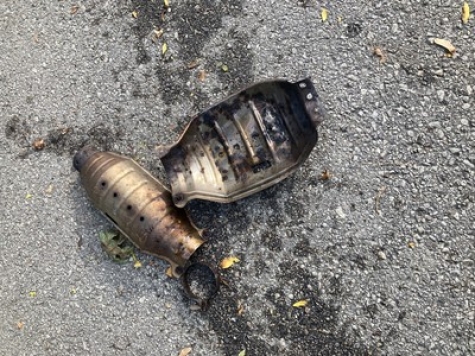 A heat shield lies on the ground after thieves stole the catalytic converter from Madison resident Paul Schechter&#039;s truck in August. 