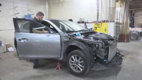  A car gets worked on at Williams Auto Body in Ashwaubenon, WI, after hitting a deer.