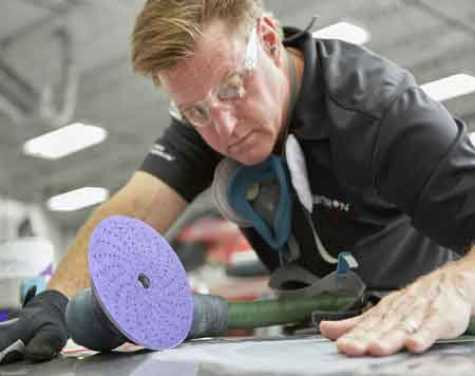 Automotive celebrity Chip Foose demonstrating products from 3M Automotive Aftermarket Division.