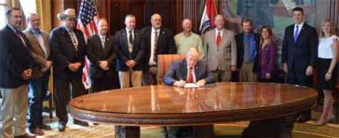 Gov. Mike Parson signs his first five bills as head of state.