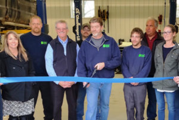 West Michigan Collision employees, friends and family at recent ribbon cutting to celebrate expansion: (From L to R) Kim Neveau, Jason Behrendt, Rick Ross, owner John Ross, Joe Smith, Kealan Lydell, Bruce Kwekle (BDD Construction) and Elizabeth Ross.