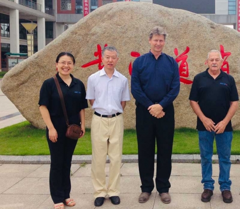 Pictured, left to right, are Sue Zheng; Zhang Jingwei, vice president of the China Automobile Maintenance and Repair Association; Ron Olsson, president of Pro Spot International; and Tony Simon, during a student skills competition in Wu Xi, China, in 2013.
