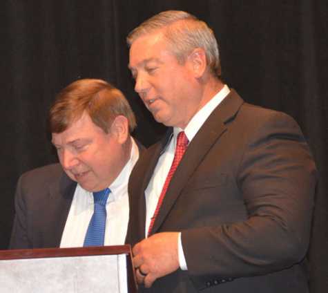 Bob Wills, ASA incoming chairman (left), officially took office as Roy Schnepper ceremoniously passed the gavel and became past chairman.