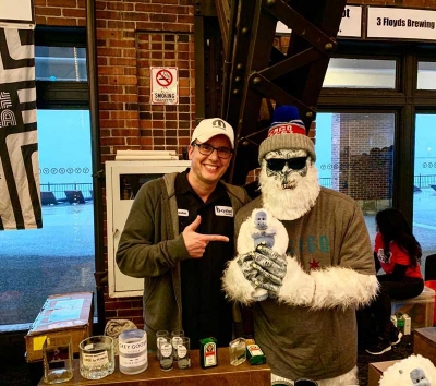 Brandon Eckenrode, director of development for CREF, founded B-Cycled Bottles to “upcycle” liquor bottles into shot, rocks and tumbler glasses. Here he is at the 2020 Chicago Beer Festival with the Beer Yeti mascot.