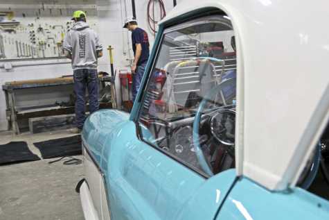 Trace Hunt and Jordan Sutter work in Northwest Technical School&#039;s auto body shop. The students repaired the &#039;50s-era car under the instruction of Ron Wiederholt. 