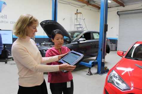 Barbara Davies, co-owner and general manager of Autobody News, received a demonstration of Mitchell Diagnostics from GeengYee Chong, product manager for Mitchell Auto Physical Damage.