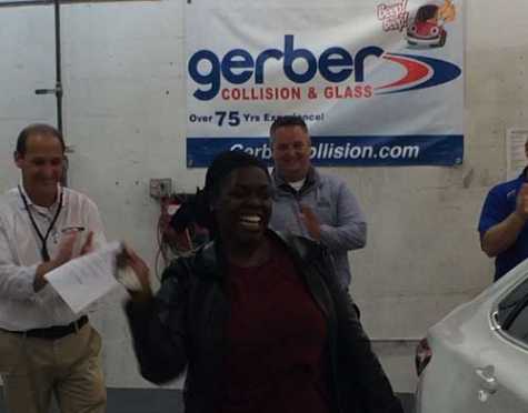 Annette Smith in the moment of receiving her car keys at Gerber Collision &amp; Glass, located on Mayfield Road in Mayfield Heights, OH. 