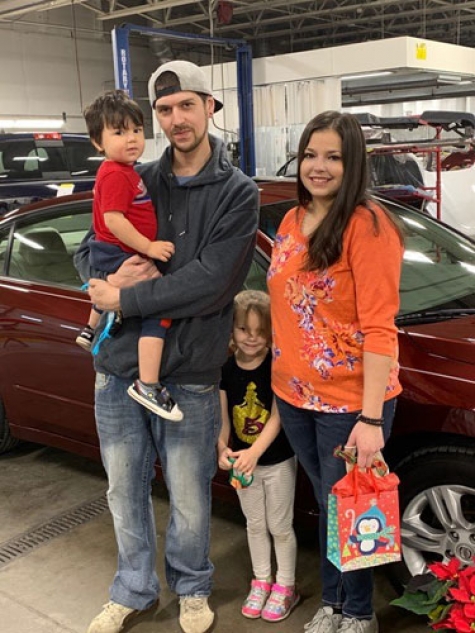 Julisiana Olivarez with her newly refurbished 2012 Nissan Altima with son Brodie, daughter Callie and significant other Mike.